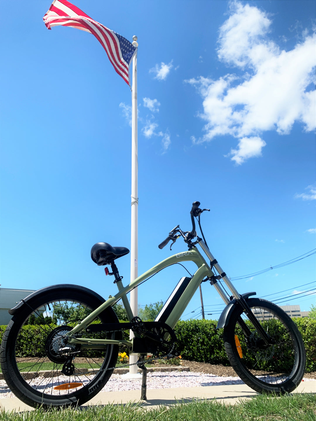 An Electric Chopper bike in front of an American flag