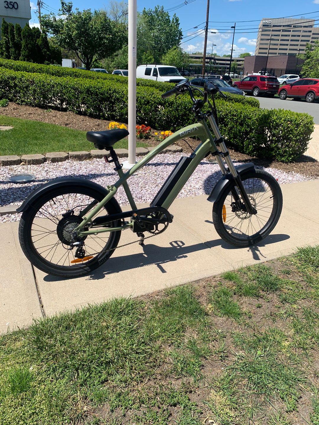 An Electric Chopper bike in front of a flagpole